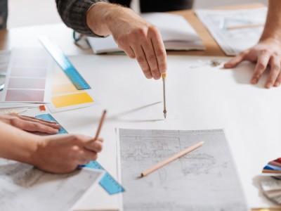 Construction professionals identifying potential work flaws 